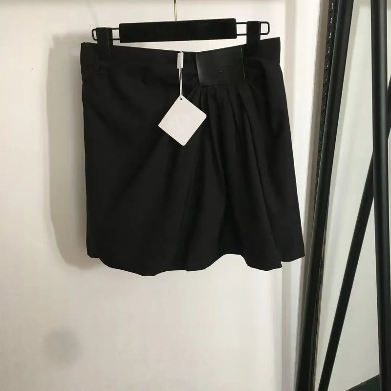 Asymmetric Pleated High-Waist Skirt — Edgy Irregular Hem in Black or Khaki — front view
