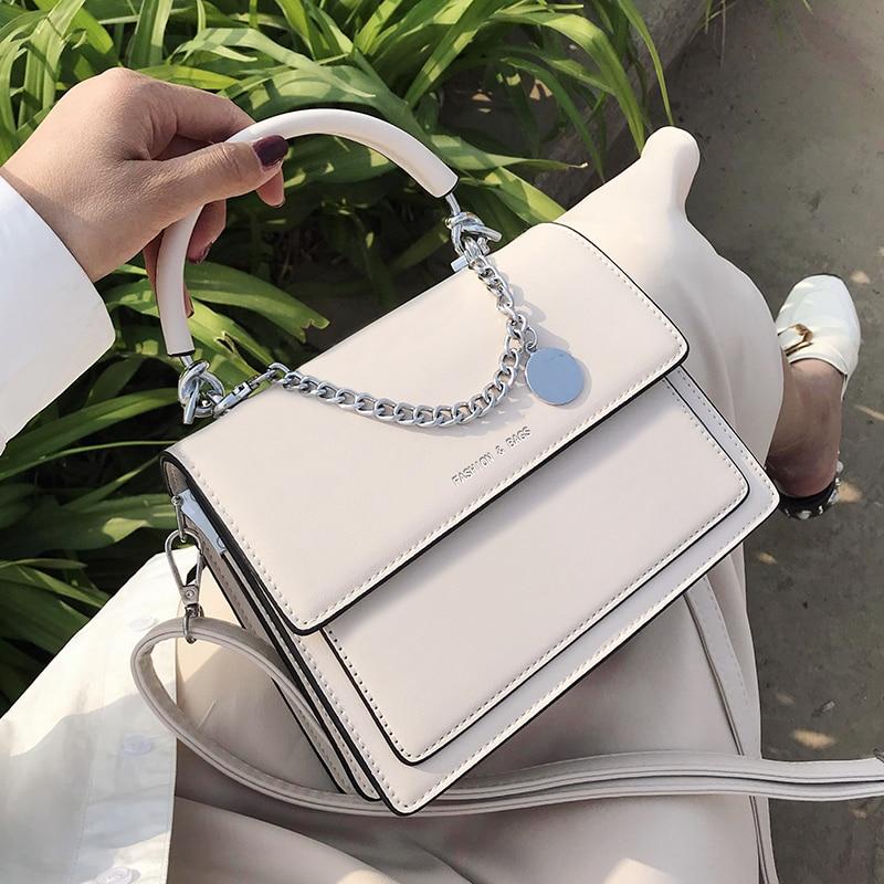 A structured, top-handle leather tote — the quiet-luxury essential