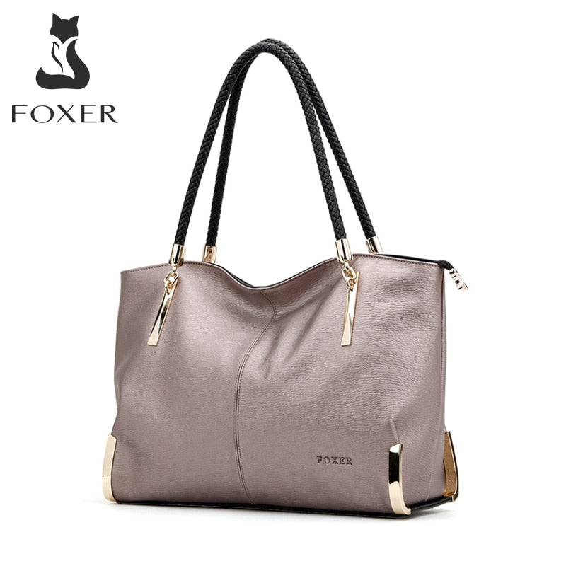 A cow-leather handbag, photographed to show grain and craftsmanship