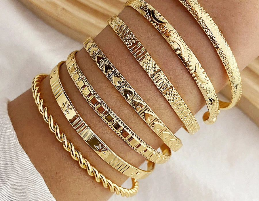 7-piece gold bangle bracelet set with heart prints for women