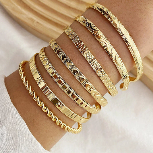 7-piece gold bangle bracelet set with heart prints for women