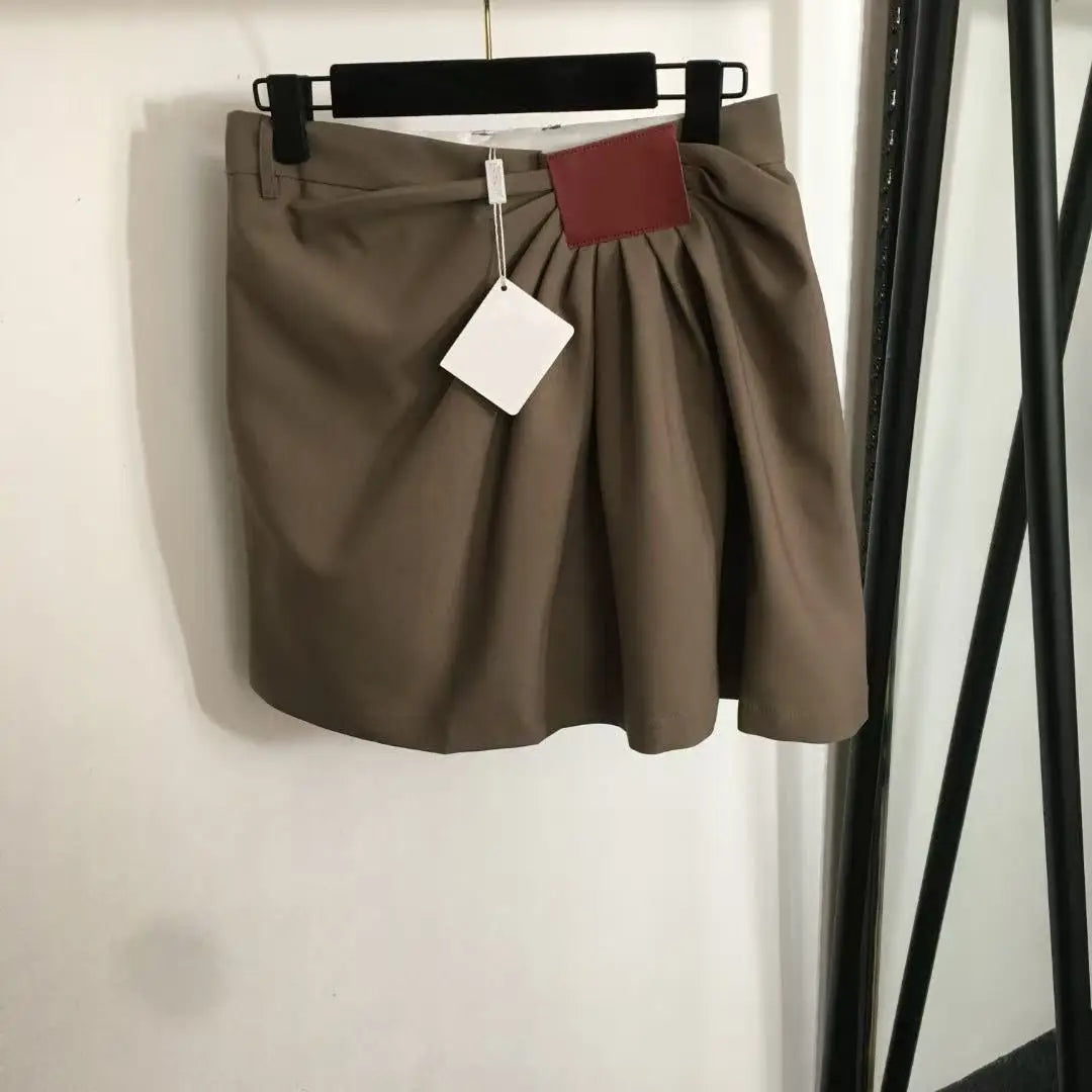 Asymmetric Pleated High-Waist Skirt — Edgy Irregular Hem in Black or Khaki — side detail