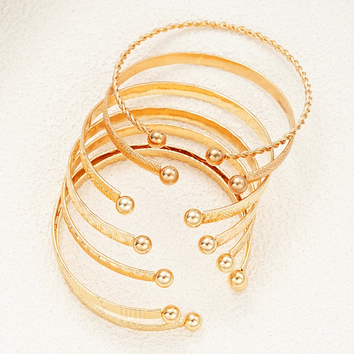 7-piece gold bangle bracelet set with heart prints for women — view 3
